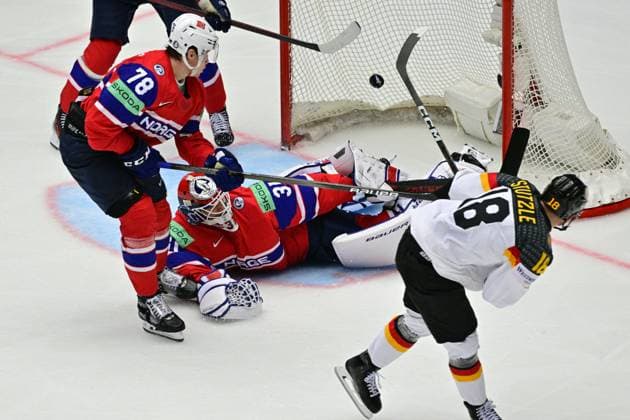 Bilder des Jahres 2025, Sport 05 Mai Sport Themen der Woche KW20 Sport Bilder des Tages L-R Emil Lilleberg (NOR), goalkeeper Jonas Arntzen (NOR) and Tim Stutzle (GER) in action during the Group B match Norway vs Germany at the 2025 IIHF Ice hockey, Eishockey World Championship, WM, Weltmeisterschaft in Herning, Denmark, May 13, 2025. (CTKxPhoto VitxSimanek) CTKPhotoP2025051307501  CTKPhotoP2025051307501
