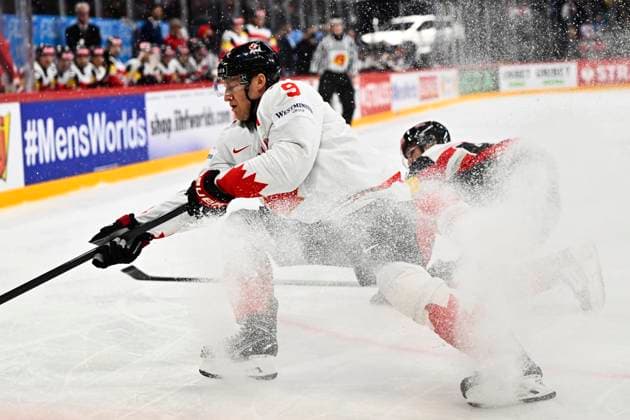 Sport Bilder des Tages Canada s Nate MacKinnon and Austria s Gregor Biber during the IIHF Ice hockey, Eishockey World Championship, WM, Weltmeisterschaft group A match between Canada and Austria at Avicii Arena in Stockholm, Sweden, on May 15, 2025. STOCKHOLM SWEDEN x10040x
