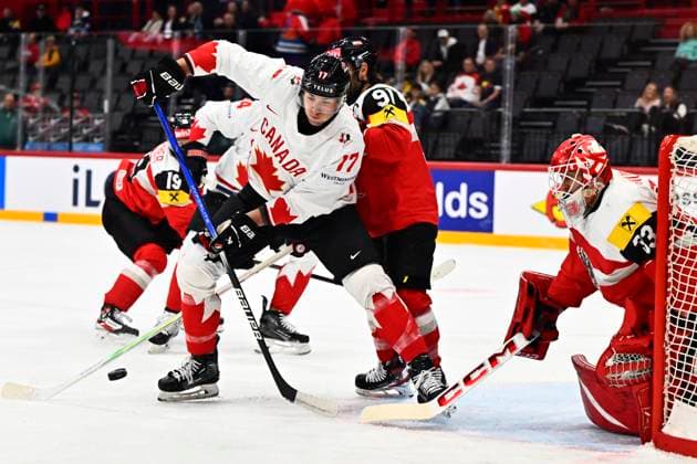 Canada s Will Cuylle and Austria s Dominique Heinrich and Florian Vorauer during the IIHF Ice hockey, Eishockey World Championship, WM, Weltmeisterschaft group A match between Canada and Austria at Avicii Arena in Stockholm, Sweden, on May 15, 2025. STOCKHOLM SWEDEN x10040x