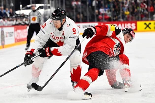 Sport Bilder des Tages Canada s Nate MacKinnon and Austria s Gregor Biber during the IIHF Ice hockey, Eishockey World Championship, WM, Weltmeisterschaft group A match between Canada and Austria at Avicii Arena in Stockholm, Sweden, on May 15, 2025. STOCKHOLM SWEDEN x10040x