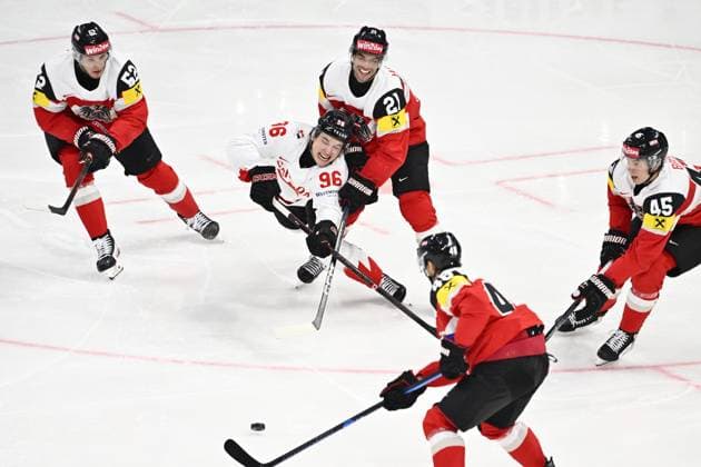 STOCKHOLM, SWEDEN 20250515 Canada s Macklin Celebrini and Austria s Lukas Haudum during the IIHF Ice hockey, Eishockey World Championship, WM, Weltmeisterschaft group A match between Canada and Austria at Avicii Arena in Stockholm, Sweden, on May 15, 2025. STOCKHOLM SWEDEN x10040x