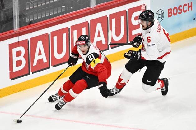 STOCKHOLM, SWEDEN 20250515 Austria s Lukas Haudum and Canada s Travis Sanheim during the IIHF Ice hockey, Eishockey World Championship, WM, Weltmeisterschaft group A match between Canada and Austria at Avicii Arena in Stockholm, Sweden, on May 15, 2025. STOCKHOLM SWEDEN x10040x