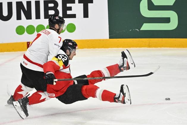 STOCKHOLM, SWEDEN 20250515 Canada s Mike Matheson and Austria s Paul Huber during the IIHF Ice hockey, Eishockey World Championship, WM, Weltmeisterschaft group A match between Canada and Austria at Avicii Arena in Stockholm, Sweden, on May 15, 2025. STOCKHOLM SWEDEN x10040x