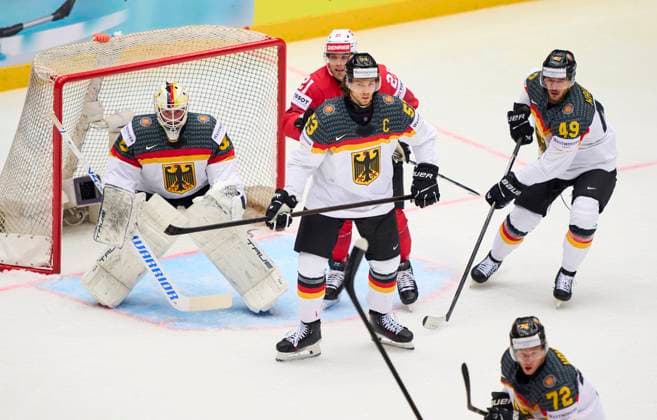 Moritz Seider 53 of Germany Mathias Niederberger Nr. 35 goalie of Germany Lukas Kälble, Kaelble Nr.49 of Germany compete and fight for the puck against Kevin Fiala 21 of Switzerland in the preliminary round match SWITZERLAND - GERMANY 5-1 of the IIHF Ice hockey, Eishockey World Championship, WM, Weltmeisterschaft Group B in Jyske Bank Arena in Herning, Denmark, May 15, 2025. Season 2024 2025