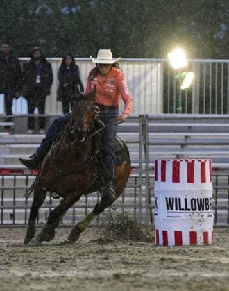 (250517) -- SURREY, May 17, 2025 -- A rider competes in the ladies barrel racing competition at the Cloverdale Rodeo and Country Fair in Surrey, British Columbia, Canada, May 16, 2025. As one of the largest rodeos in Canada, the annual Cloverdale Rodeo and Country Fair kicked off here on Friday. (Photo by Xinhua) (SP)CANADA-SURREY-CLOVERDALE RODEO LiangxSen 