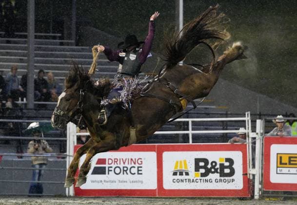 (250517) -- SURREY, May 17, 2025 -- A rider competes in the saddle bronc riding competition at the Cloverdale Rodeo and Country Fair in Surrey, British Columbia, Canada, May 16, 2025. As one of the largest rodeos in Canada, the annual Cloverdale Rodeo and Country Fair kicked off here on Friday. (Photo by Xinhua) (SP)CANADA-SURREY-CLOVERDALE RODEO LiangxSen 