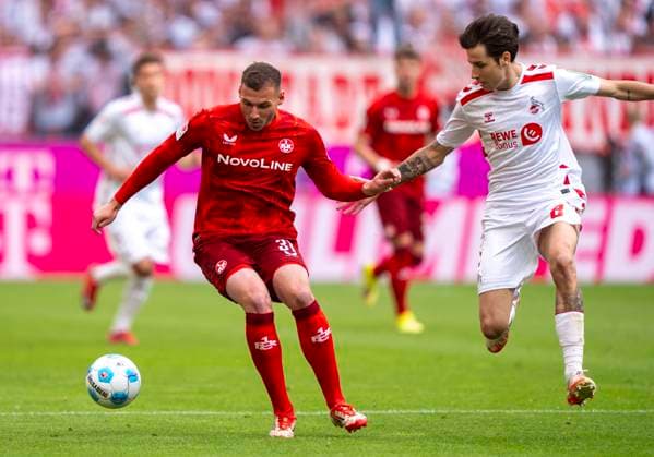 Zweikampf zwischen: Luca Sirch (1. FC Kaiserslautern, 31) und Denis Huseinbasic (1. FC Koeln, 8) 18.05.2025, 1. FC Köln - 1. FC Kaiserslautern Fussball, 2. Bundesliga, RheinEnergieStadion Köln DFL regulations prohibit any use of photographs as image sequences and or quasi-video.