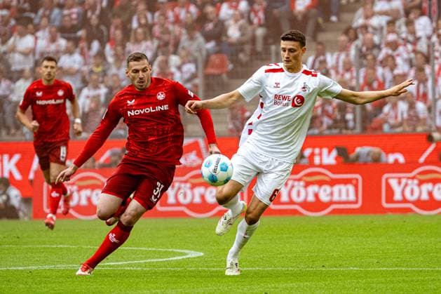 18.05.2025, Fussball: 2. Bundesliga, Saison 2024 2025, 34. Spieltag, 1. FC Koeln - 1. FC Kaiserslautern im RheinEnergieStadion in Koeln. Zweikampf zwischen Luca Sirch (1. FC Kaiserslautern, 31) und Eric Martel (1. FC Koeln, 06). Wichtiger Hinweis: Gemaess den Vorgaben der DFL Deutsche Fussball Liga bzw. des DFB Deutscher Fussball-Bund ist es untersagt, in dem Stadion und oder vom Spiel angefertigte Fotoaufnahmen in Form von Sequenzbildern und oder videoaehnlichen Fotostrecken zu verwerten bzw. verwerten zu lassen. Foto: Kirchner-Media Thomas Haesler