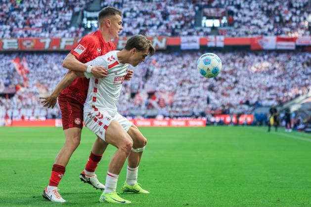 Fußball 2. Bundesliga 34. Spieltag 1. FC Köln - 1. FC Kaiserslautern am 18.05.2025 im RheinEnergieStadion in Köln Filip Kaloc ( Kaiserslautern ), links - Joel Schmied ( Köln ), rechts DFL regulations prohibit any use of photographs as image sequences and or quasi-video.