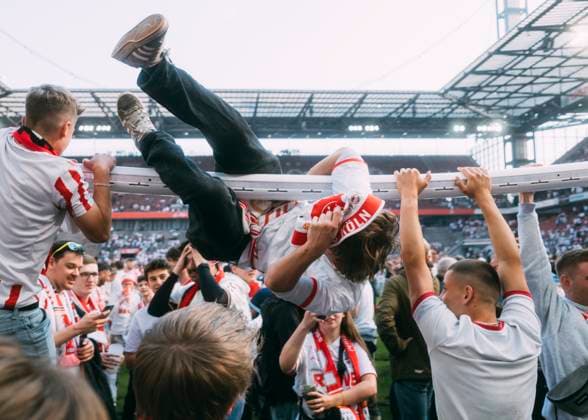 Köln, RheinEnergieStadion, 18.05.2025: Fans of 1.FC Koeln celebrate the win of the cup after the 2.Bundesliga match 1.FC Köln vs. 1.FC Kaiserslautern.