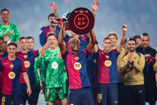 Lamine Yamal FC Barcelona, Barca celebrates the 2024 2025 La Liga EA Sports championship, the Spanish Supercopa and the Copa del Rey with the trophy during the LaLiga match between FC Barcelona and Villarreal CF at Olimpic Lluis Companys on May 18, 2025 in Barcelona, Spain. (Photo by Xavi Bonilla DeFodi Images)