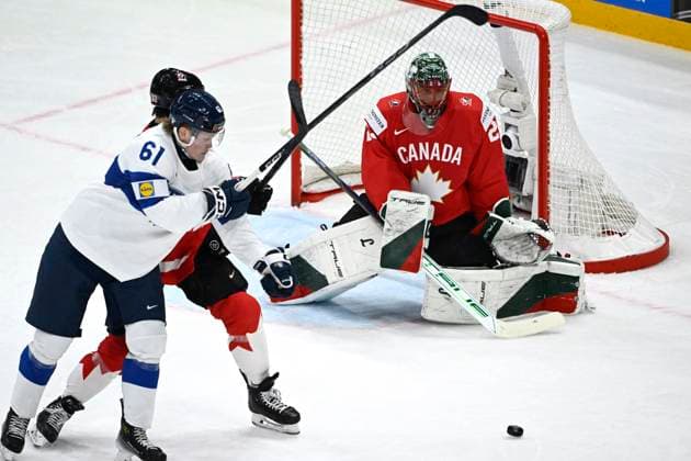 STOCKHOLM, SWEDEN 20250519 Finland s Juuso Parssinen and Canada s goalkeeper Marc-Andre Fleury during the IIHF Ice hockey, Eishockey World Championship, WM, Weltmeisterschaft group A match between Canada and Finland at Avicii Arena in Stockholm, Sweden, on May 19, 2025. STOCKHOLM SWEDEN x10080x