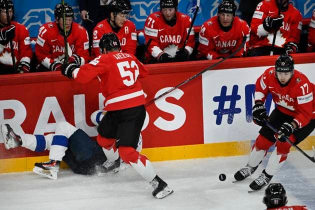 STOCKHOLM, SWEDEN 20250519 Canada s Mackenzie Weegar Canada tackles a Finnish player during the IIHF Ice hockey, Eishockey World Championship, WM, Weltmeisterschaft group A match between Canada and Finland at Avicii Arena in Stockholm, Sweden, on May 19, 2025.Â¨ STOCKHOLM SWEDEN x10080x