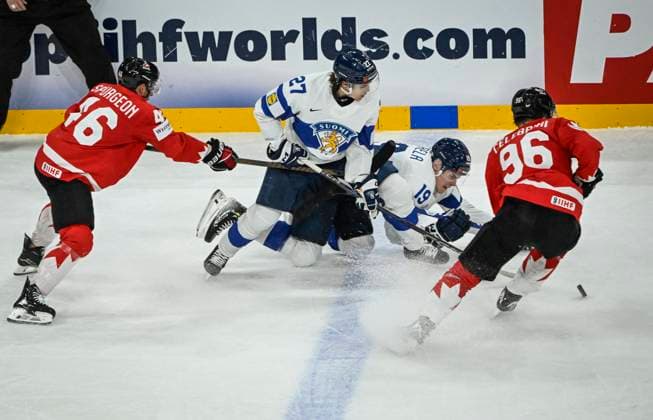 STOCKHOLM, SVERIGE 20250519 Canada s Jared Spurgeon ( 46) and Macklin Celebrini ( 96) fight for the puck with Finland s Mikael Pyyhtiä ( 27) and Waltteri Merela ( 19) during the IIHF Ice hockey, Eishockey World Championship, WM, Weltmeisterschaft group A match between Canada and Finland at Avicii Arena in Stockholm, Sweden, on May 19, 2025. STOCKHOLM SVERIGE x10080x