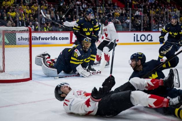 250520 Goaltender Jacob Markström, Rasmus Andersson and Marcus Pettersson of Sweden look dejected and Tyson Foerster of Canada celebrates after 1-2 during the 2025 IIHF Ice hockey, Eishockey World Championship, WM, Weltmeisterschaft group stage game between Sweden and Canada on May 20, 2025 in Stockholm. Photo: Joel Marklund BILDBYRAN kod JM JM0689 ishockey ice hockey ishockey-vm 2025 vm 2025 iihf world championship sverige sweden kanada canada bbeng gruppspel jubel depp Copyright: JOELxMARKLUND BB250520JM013