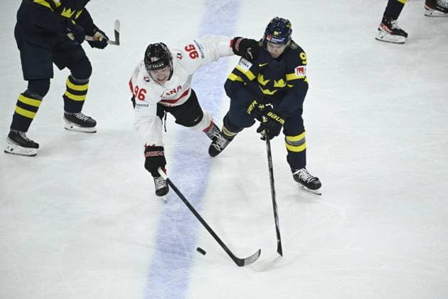 STOCKHOLM, SWEDEN 20250520 Canada s Macklin Celebrini and Sweden s Leo Carlsson during the IIHF Ice hockey, Eishockey World Championship, WM, Weltmeisterschaft group A match between Sweden and Canada at Avicii Arena in Stockholm, Sweden, on May 20, 2025. STOCKHOLM SWEDEN x10080x