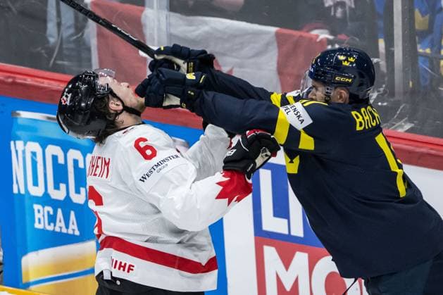 250520 Travis Sanheim of Canada and Mikael Backlund of Sweden during the 2025 IIHF Ice hockey, Eishockey World Championship, WM, Weltmeisterschaft group stage game between Sweden and Canada on May 20, 2025 in Stockholm. Photo: Simon Hastegard BILDBYRAN kod SH JM0689 ishockey ice hockey ishockey-vm 2025 vm 2025 iihf world championship sverige sweden kanada canada bbeng gruppspel Copyright: SIMONxHASTEGARD BB250520SH028