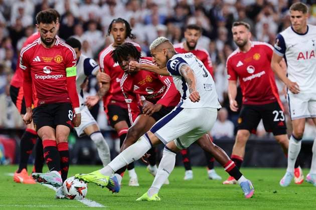 Richarlison de Andrade of Tottenham Hotspur, challenged by Bruno Fernandes and Patrich Dorgu of Manchester United, ManU in action during the 2024 2025 Europa League Final football match between Tottenham Hotspur and Manchester United at San Mames stadium in Bilbao (Spain), May 21st, 2025. CesarexPurini