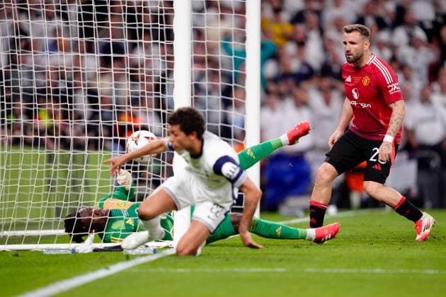 Luke Shaw of Manchester United, ManU appears to score an own goal to make it 1-0 to Tottenham Hotspur but Brennan Johnson of Tottenham Hotspur claims it Tottenham Hotspur v Manchester United, Europa League Final, Football, San Mames Stadium, Bilbao, Spain - 21 May 2025 EDITORIAL USE ONLY No use with unauthorised audio, video, data, fixture lists, club league logos or live services. Online in-match use limited to 120 images, no video emulation. No use in betting, games or single club league player publications.  Copyright: xGokhanxTaner Shutterstockx 15312892dn