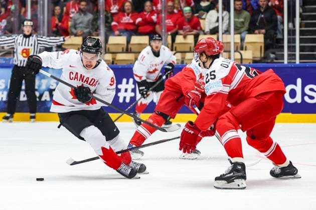 Ice hockey, Eishockey - IIHF WC 2025 HERNING,DENMARK,22.MAY.25 - ICE HOCKEY - IIHF Ice Hockey World Championship, WM, Weltmeisterschaft 2025, quarterfinal, Canada vs Denmark. Image shows Macklin Celebrini (CAN) and Oliver Lauridsen (DEN).  GEPAxpictures xMaticxKlansek