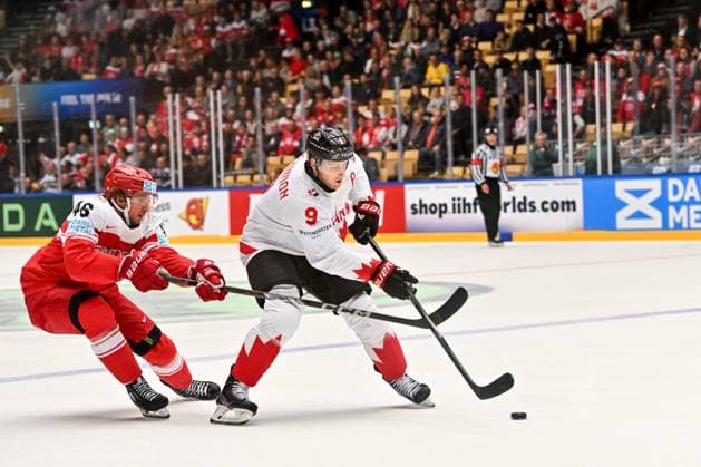ODENSE, DENMARK - MAY 22: Nathan Mackinnon of Canada protects the puck from Jonas Rondbjerg of Denmark during the 2025 Ice hockey, Eishockey World Championship, WM, Weltmeisterschaft match between Canada and Denmark at Jyske Bank Arena on May 22, 2025 in Odense, Denmark. Odense Jyske Bank Arena Denmark Copyright: xJustPictures.ch AndreaxBrancax jp-en-EuSpIm-AB_22052025_AAB_0674