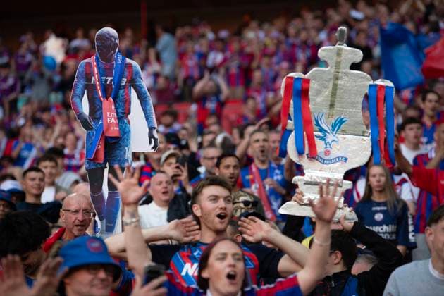 Crystal Palace v Manchester City - Emirates FA Cup Final LONDON, ENGLAND - MAY 17: Jubilant Crystal Palace fans with cardboard cutouts of the FA Cup trophy and Palace striker Jean-Philippe Mateta celebrate after watching their team win the Emirates FA Cup Final match between Crystal Palace and Manchester City at Wembley Stadium on May 17, 2025 in London, England. London Wembley Stadium England United Kingdom Copyright: xVisionhausx 776318008