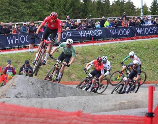 From left Christopher Blevins of USA and Luca Schwarzbauer of Germany compete during the short track during the Mountain bike cross country World Cup event, Nove Mesto na Morave, Czech Republic, May 24, 2025. (CTKxPhoto LiborxPlihal) CTKPhotoP2025052402479  CTKPhotoP2025052402479