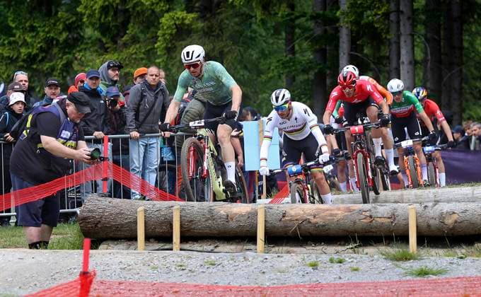 From left Luca Schwarzbauer of Germany, Victor Koretzky of France, Christopher Blevins of USA compete during the short track during the Mountain bike cross country World Cup event, Nove Mesto na Morave, Czech Republic, May 24, 2025. (CTKxPhoto LiborxPlihal) CTKPhotoP2025052402635  CTKPhotoP2025052402635