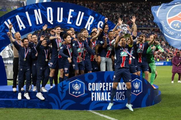 Saint Denis, France, May 24, 2025 - Paris Saint Germain s Brazilian defender 05 Marquinhos raises the trophy as he celebrates with teammates after winning French Cup final football match between Paris Saint Germain (PSG) and Stade de Reims at the Stade de France.  Copyright: xAlexisxSciardx