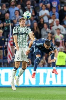 May 24, 2025: New England Revolution defender Wyatt Omsberg (16) heads the ball over Sporting Kansas City midfielder Erik Thommy (26) during the second half at Childrens Mercy Park in Kansas City, KS. CSM Kansas City United States of America - ZUMAc04_ 20250524_zma_c04_431 Copyright: xDavidxSmithx