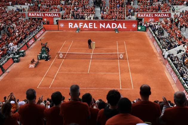 Tennis great, Rafael Nadal of Spain, stands alone before a large crowd during a tribute ceremony in his honor, on the first day of the Roland Garros French Tennis Open in Paris, France, on Sunday, May 25, 2025. Nadal was honored in a special farewell ceremony that celebrated his extraordinary legacy in Paris.  PAR20250525117 MAYAxVIDON-WHITE