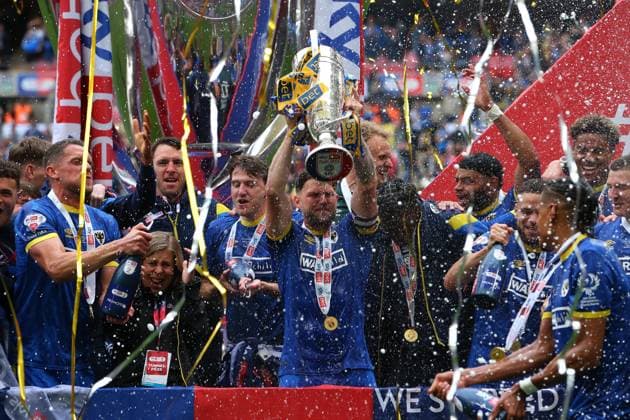 26th May 2025; Wembley Stadium, London, England; EFL League Two Play Off Football Final, AFC Wimbledon versus Walsall; AFC Wimbledon captain Jake Reeves lifts the Sky Bet League Two Play-off winners trophy  ActionPlus12794823 KatiexChan
