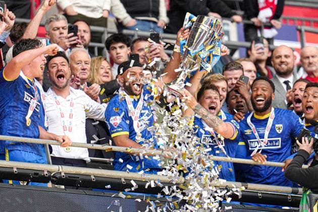 Sky Bet League 2 Playoff Final AFC Wimbledon v Walsall Wimbledon lift the league 2 play off final trophy after the Sky Bet League 2 Playoff Final match AFC Wimbledon vs Walsall at Wembley Stadium, London, United Kingdom, 26th May 2025 (Photo by Harvey Murphy News Images) Copyright: xHarveyxMurphy NewsxImagesx