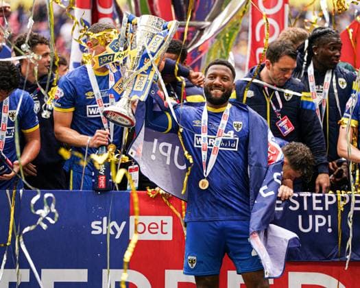 Sky Bet League 2 Playoff Final AFC Wimbledon v Walsall Myles Hippolyte of AFC Wimbledon celebrating with the trophy after the Sky Bet League 2 Playoff Final match AFC Wimbledon vs Walsall at Wembley Stadium, London, United Kingdom, 26th May 2025 (Photo by Harvey Murphy News Images) Copyright: xHarveyxMurphy NewsxImagesx