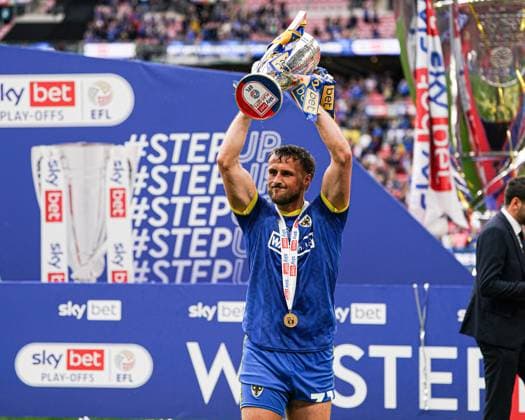 Sky Bet League 2 Playoff Final AFC Wimbledon v Walsall Joe Lewis of AFC Wimbledon lifts trophy after the Sky Bet League 2 Playoff Final match AFC Wimbledon vs Walsall at Wembley Stadium, London, United Kingdom, 26th May 2025 (Photo by Harvey Murphy News Images) Copyright: xHarveyxMurphy NewsxImagesx