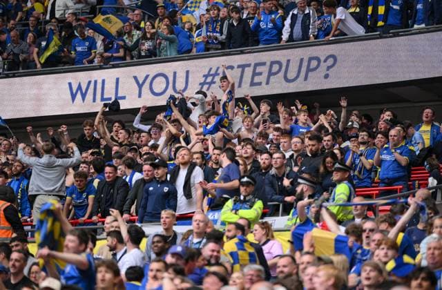 Football - 2024 2025 EFL Sky Bet League Two - Play-Offs - Final - AFC Wimbledon vs Walsall - Wembley Stadium - Monday 26th May 2025. AFC Wimbledon fans celebrate as Myles Hippolyte scores the opening goal. COLORSPORT Ashley Western 