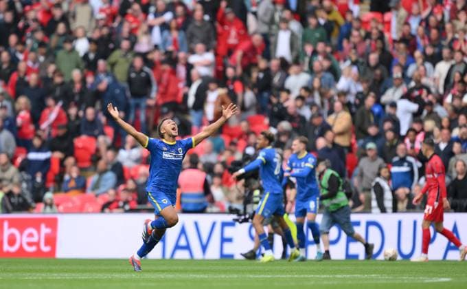 Football - 2024 2025 EFL Sky Bet League Two - Play-Offs - Final - AFC Wimbledon vs Walsall - Wembley Stadium - Monday 26th May 2025. AFC Wimbledon s Isaac Ogundere celebrates as the final whistle blows and they are promoted to League One. COLORSPORT Ashley Western 