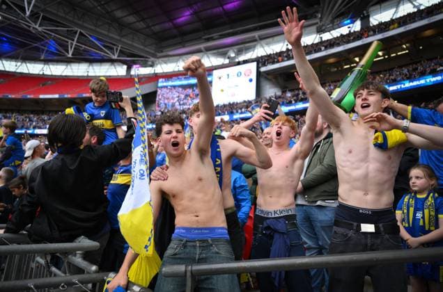 Football - 2024 2025 EFL Sky Bet League Two - Play-Offs - Final - AFC Wimbledon vs Walsall - Wembley Stadium - Monday 26th May 2025. AFC Wimbledon fans celebrate at the final whistle. COLORSPORT Ashley Western 