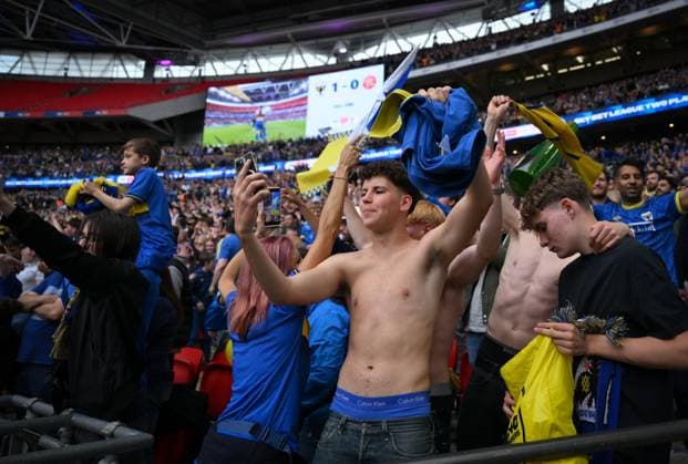 Football - 2024 2025 EFL Sky Bet League Two - Play-Offs - Final - AFC Wimbledon vs Walsall - Wembley Stadium - Monday 26th May 2025. AFC Wimbledon fans celebrate at the final whistle. COLORSPORT Ashley Western 