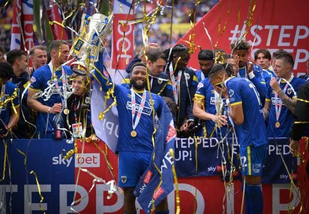 Football - 2024 2025 EFL Sky Bet League Two - Play-Offs - Final - AFC Wimbledon vs Walsall - Wembley Stadium - Monday 26th May 2025. AFC Wimbledon s Myles Hippolyte with the trophy after their 1 0 victory. COLORSPORT Ashley Western 