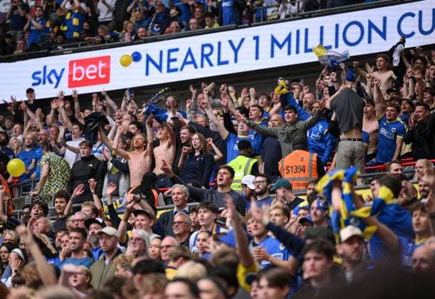 Football - 2024 2025 EFL Sky Bet League Two - Play-Offs - Final - AFC Wimbledon vs Walsall - Wembley Stadium - Monday 26th May 2025. AFC Wimbledon fans celebrate as Myles Hippolyte scores the opening goal. COLORSPORT Ashley Western 