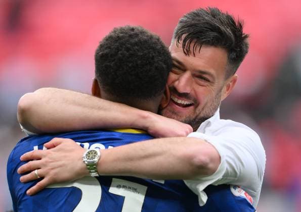 Football - 2024 2025 EFL Sky Bet League Two - Play-Offs - Final - AFC Wimbledon vs Walsall - Wembley Stadium - Monday 26th May 2025. AFC Wimbledon s Manager Johnnie Jackson with winning goalscorer Myles Hippolyte. COLORSPORT Ashley Western 
