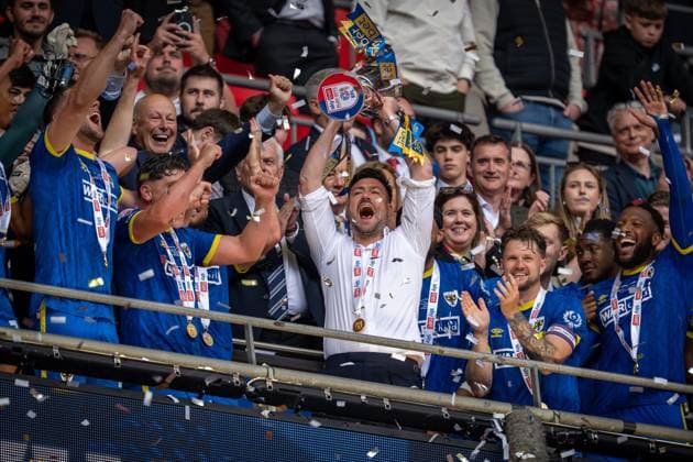 Football - 2024 2025 EFL Sky Bet League Two - Play-Offs - Final - AFC Wimbledon vs Walsall - Wembley Stadium - Monday 26th May 2025. AFC Wimbledon s Manager Johnnie Jackson lifts the trophy. COLORSPORT Ashley Western 