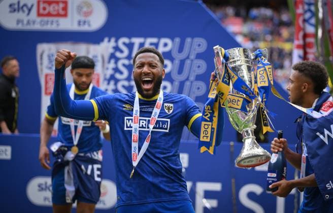 Football - 2024 2025 EFL Sky Bet League Two - Play-Offs - Final - AFC Wimbledon vs Walsall - Wembley Stadium - Monday 26th May 2025. AFC Wimbledon s winning goalscorer Myles Hippolyte with the trophy after clinching promotion. COLORSPORT Ashley Western 