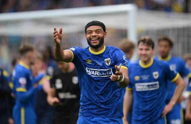 Football - 2024 2025 EFL Sky Bet League Two - Play-Offs - Final - AFC Wimbledon vs Walsall - Wembley Stadium - Monday 26th May 2025. AFC Wimbledon s Ryan Johnson celebrates after their 1 0 victory clinching promotion to League One. COLORSPORT Ashley Western 