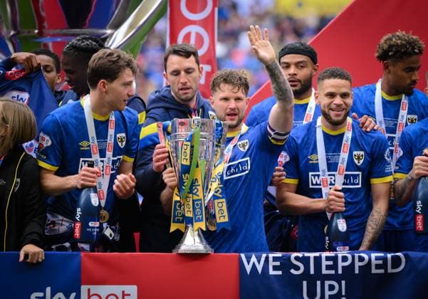 Football - 2024 2025 EFL Sky Bet League Two - Play-Offs - Final - AFC Wimbledon vs Walsall - Wembley Stadium - Monday 26th May 2025. AFC Wimbledon s Jake Reeves with the trophy after their 1 0 victory. COLORSPORT Ashley Western 