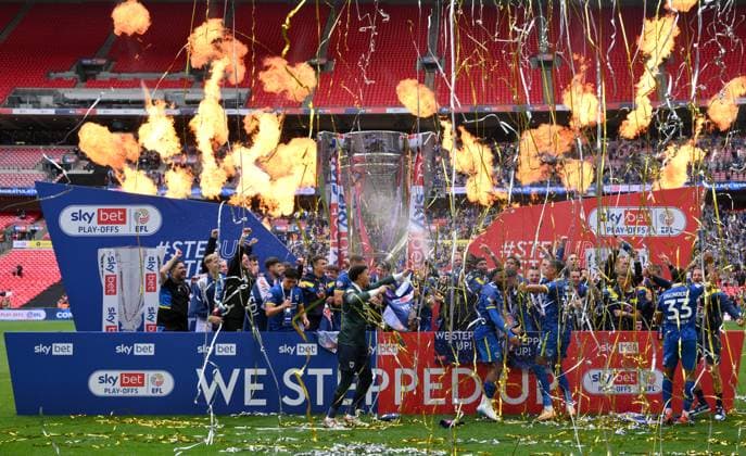 Football - 2024 2025 EFL Sky Bet League Two - Play-Offs - Final - AFC Wimbledon vs Walsall - Wembley Stadium - Monday 26th May 2025. AFC Wimbledon with the trophy after their promotion to League One. COLORSPORT Ashley Western 