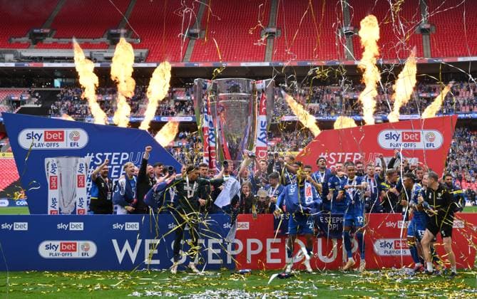 Football - 2024 2025 EFL Sky Bet League Two - Play-Offs - Final - AFC Wimbledon vs Walsall - Wembley Stadium - Monday 26th May 2025. AFC Wimbledon with the trophy after their promotion to League One. COLORSPORT Ashley Western 