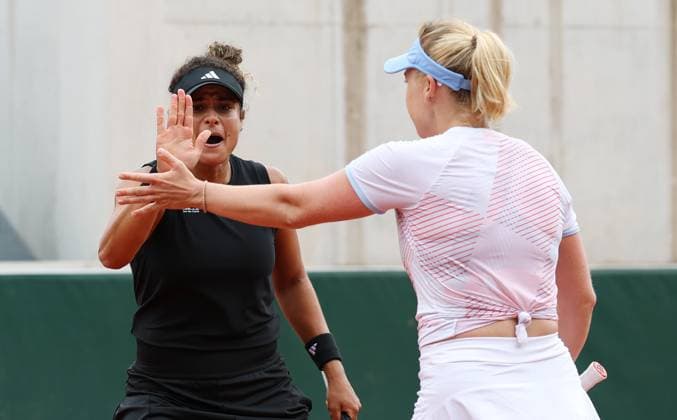 (250527) -- PARIS, May 27, 2025 -- Anna Blinkova Mayar Sherif (L) celebrate scoring during the women s doubles first round match between Lulu Sun (New Zealand) Yuan Yue (China) and Anna Blinkova (Russia) Mayar Sherif (Egypt) at the French Open tennis tournament at Roland Garros, Paris, France, May 27, 2025. ) (SP)FRANCE-PARIS-TENNIS-FRENCH OPEN-WOMEN S DOUBLES GaoxJing 