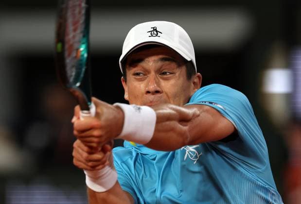 Mackenzie McDonald plays against Novak Djokovic of Serbia of the US during their first-round match at the French Tennis Open in Roland Garros in Paris, France, on Tuesday, May 27, 2025. Djokovic won 6-3, 6-3, 6-3.  PAR20250527312 MAYAxVIDON-WHITE